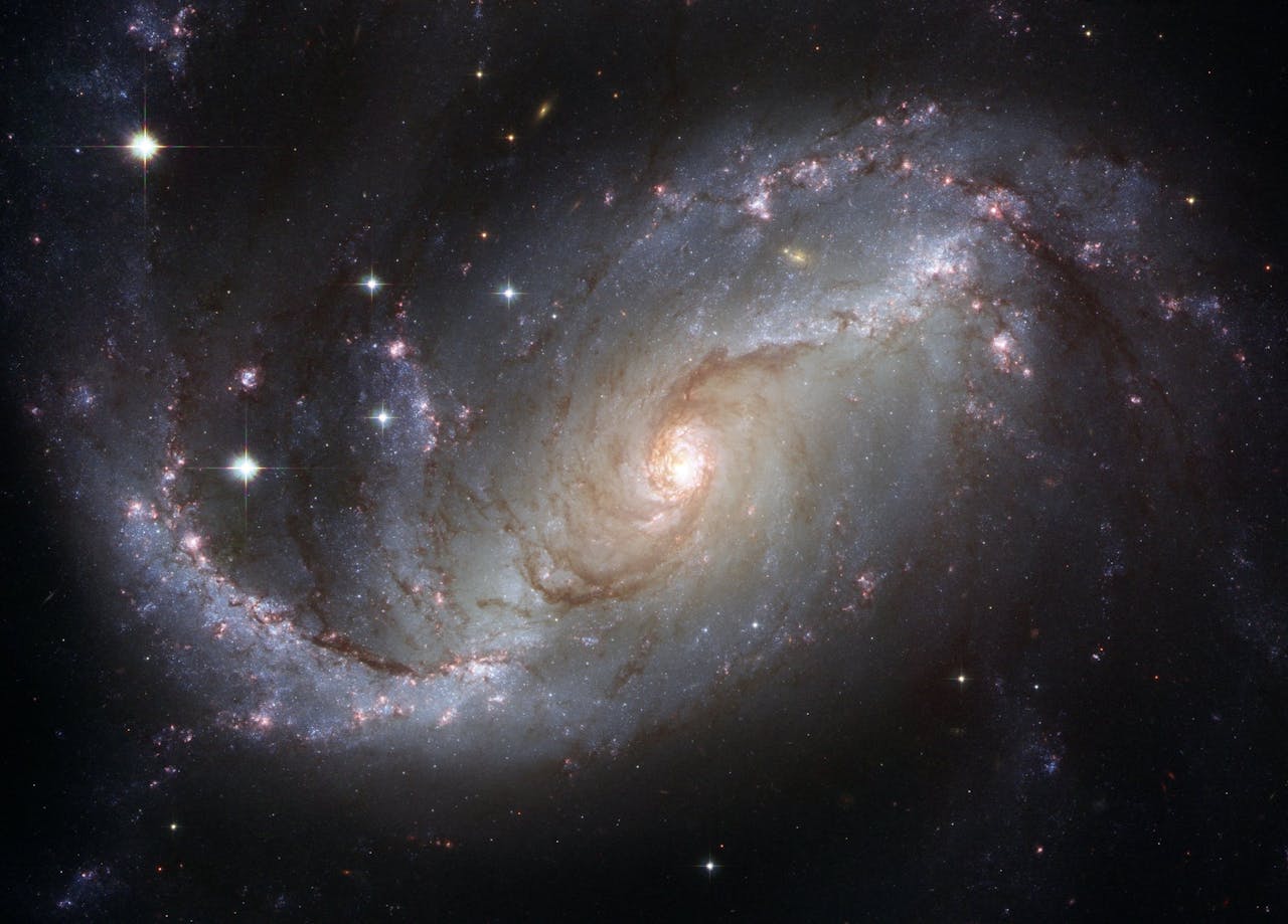 Crafting Captivating Headlines: Your awesome post title goes here Capture of the NGC 1672 spiral galaxy showcasing its majestic spiral arms and bright core.